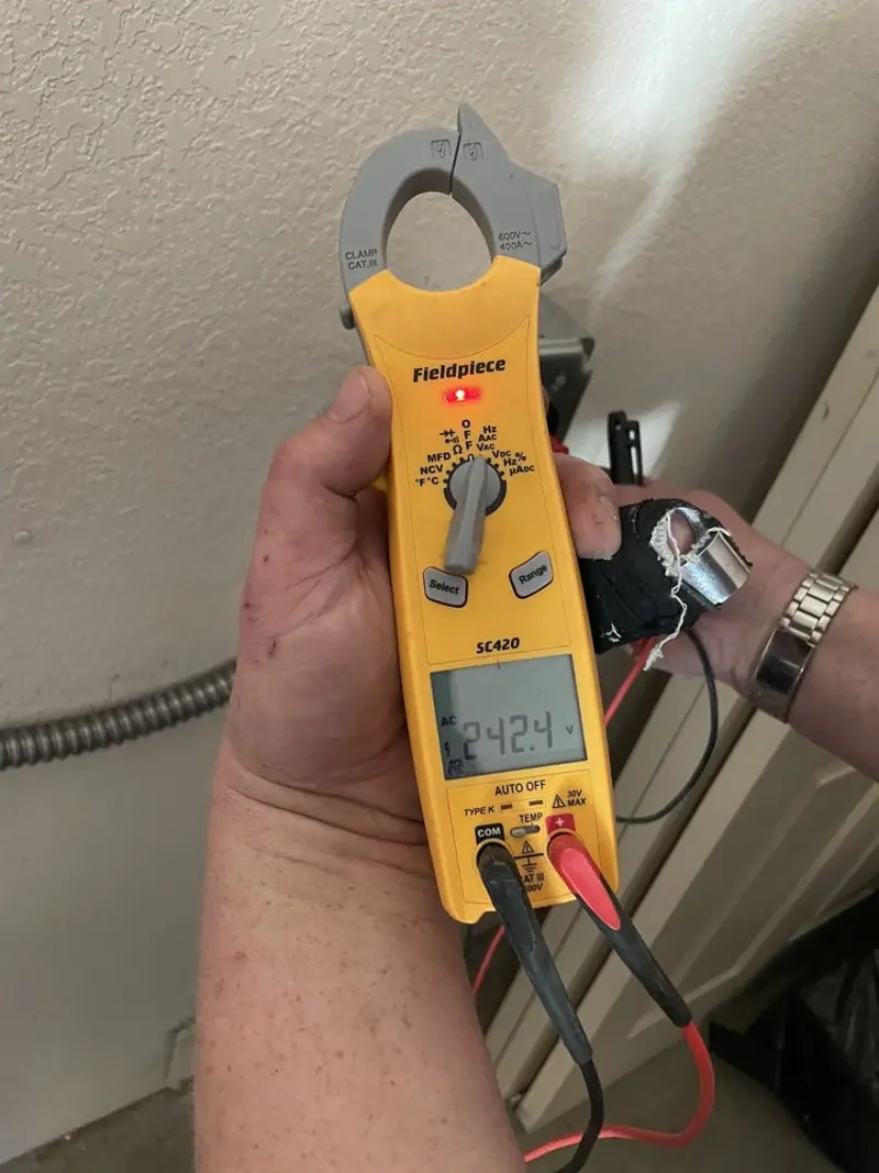 Voltage testing with clamp meter during Electrical Installation Services in Homosassa Springs